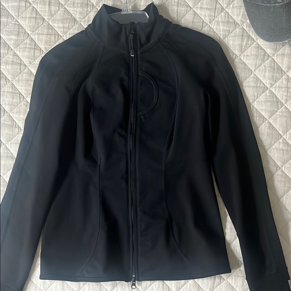 Great jacket to wear for a walk or a run. Light weight with dual zipper